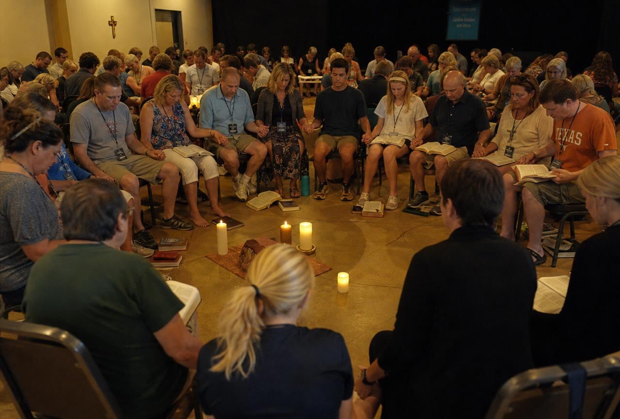 Prayer circle at a Memento faith seminar